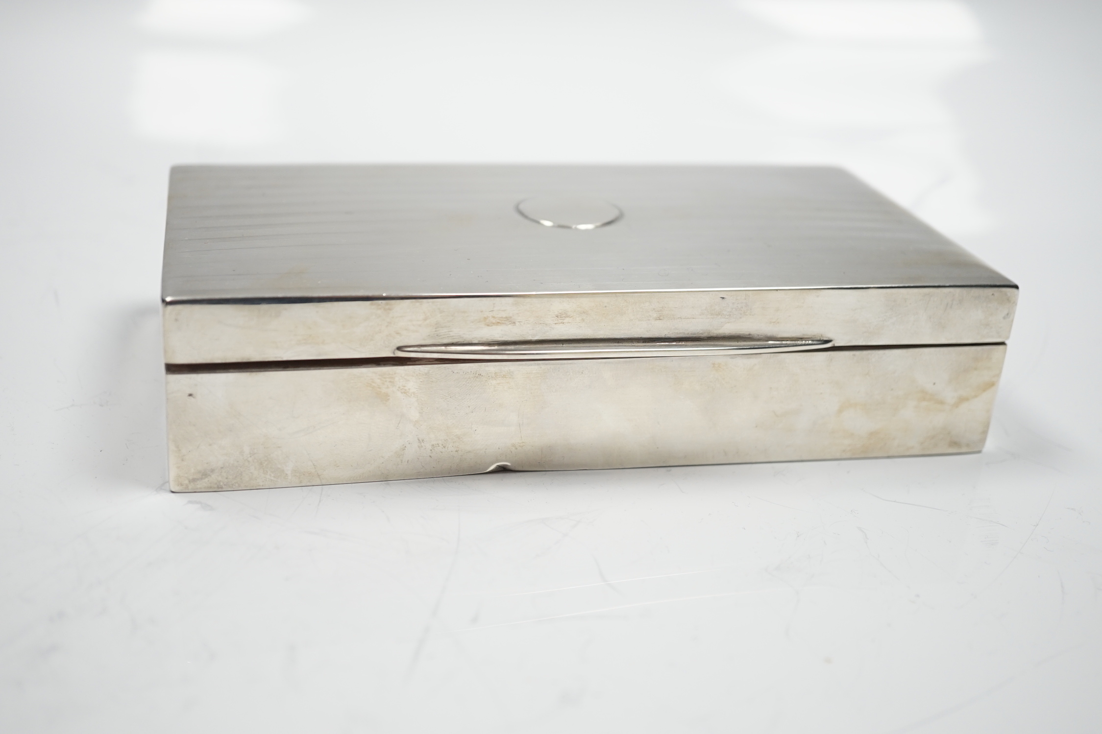 A George V silver mounted rectangular cigarette box, Birmingham, 1918, 17.2cm.